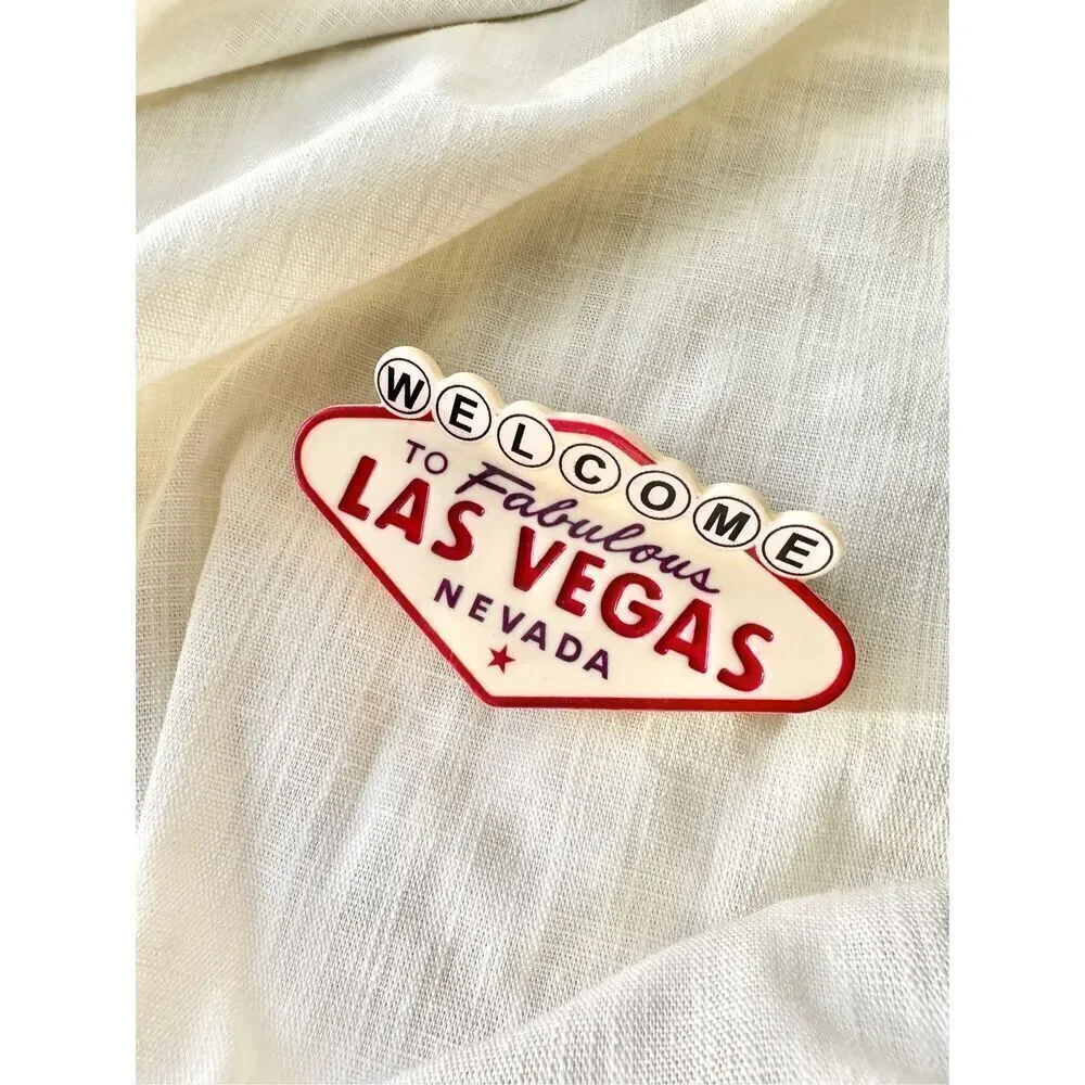 Welcome to Las Vegas black, red, and cream hair claw